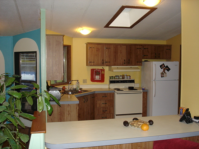 Open plan kitchen with skylight. . .